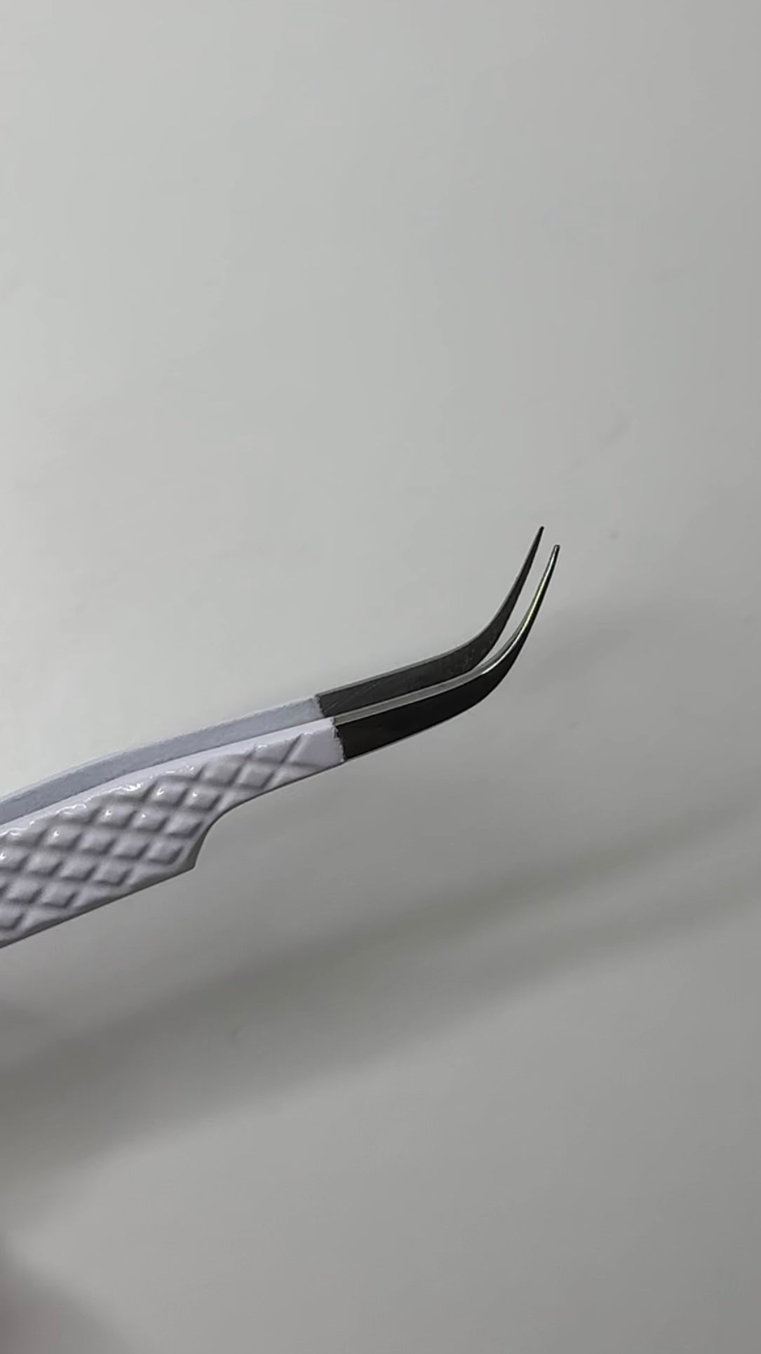 J Curve Tweezer